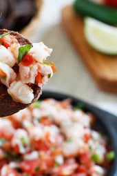 Skinny Shrimp Salsa is so good, you might not want to share! Made with shrimp, tomatoes, cilantro, red onion and lime juice. Bring this to a party and watch it disappear!