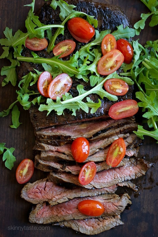 Easy dinner recipe, marinate the steak overnight if you wish then throw it on the grill the next day! Toss it with arugula and tomatoes and dinner is ready in less than 20 minutes!