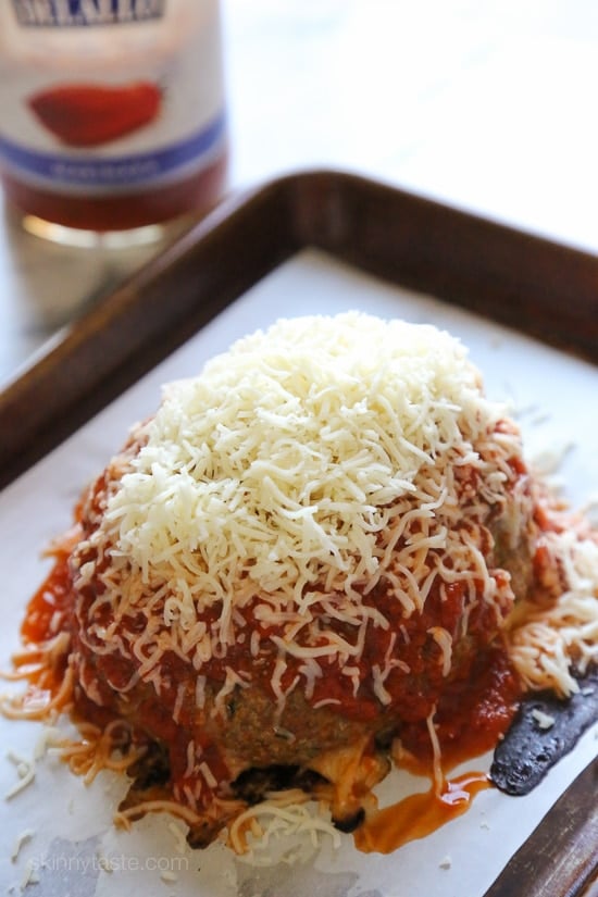 This isn't your regular meatball, it's HUGE, baked in the oven similar to how you would make a meatloaf, then topped with marinara and melted cheese – I'm OBSESSED!
