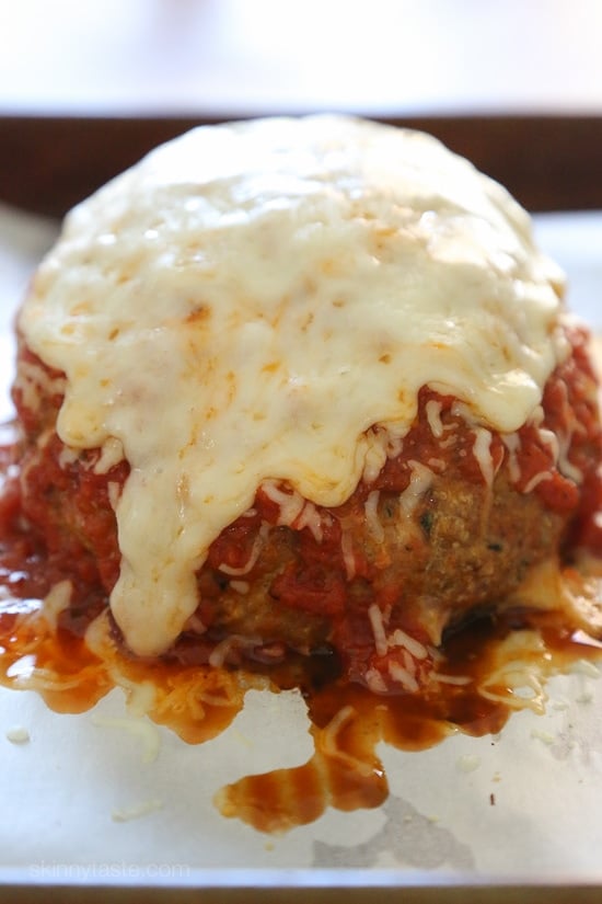This isn't your regular meatball, it's HUGE, baked in the oven similar to how you would make a meatloaf, then topped with marinara and melted cheese – I'm OBSESSED!