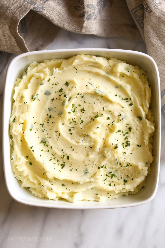 These creamy Garlic Mashed Potatoes are so much lighter than traditional mashed potatoes, and taste so darn good! The perfect side dish at any holiday.