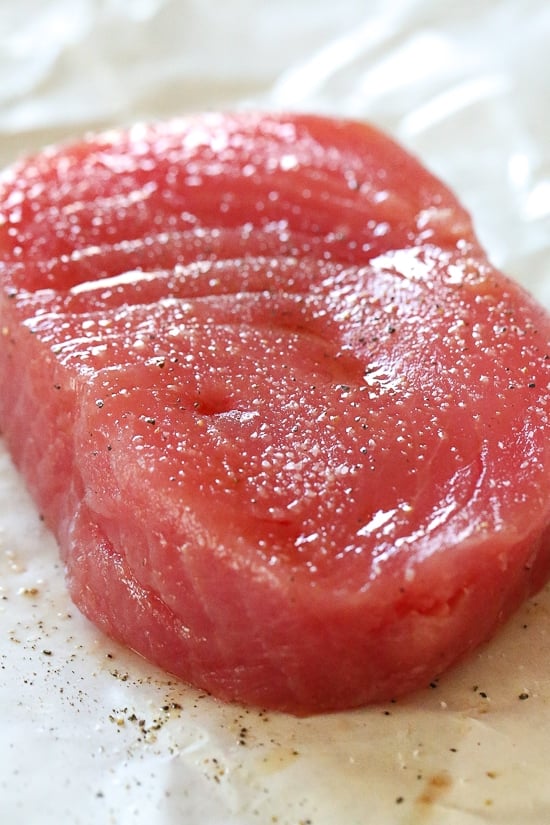 Sesame Crusted Tuna Steak on Arugula drizzled with a balsamic soy-ginger vinaigrette – yum!