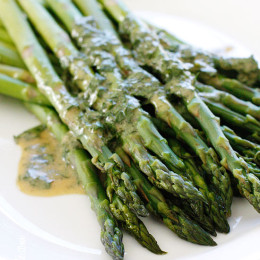 A simple asparagus side dish that really celebrates Spring. Serve it cold or room temperature, leftovers are wonderful chopped and mixed into a salad.