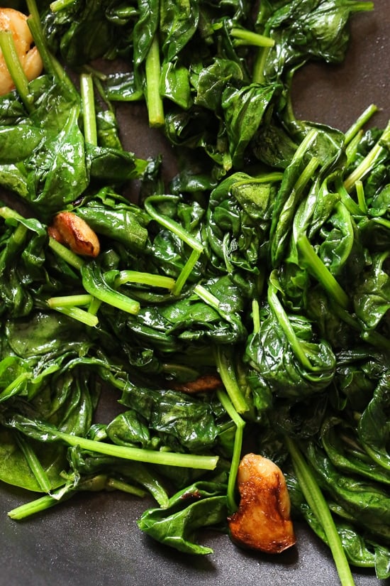 Wilted Baby Spinach with Garlic and Oil is my favorite way to prepare this easy side dish made with just 3 ingredients and ready in under 10 minutes.