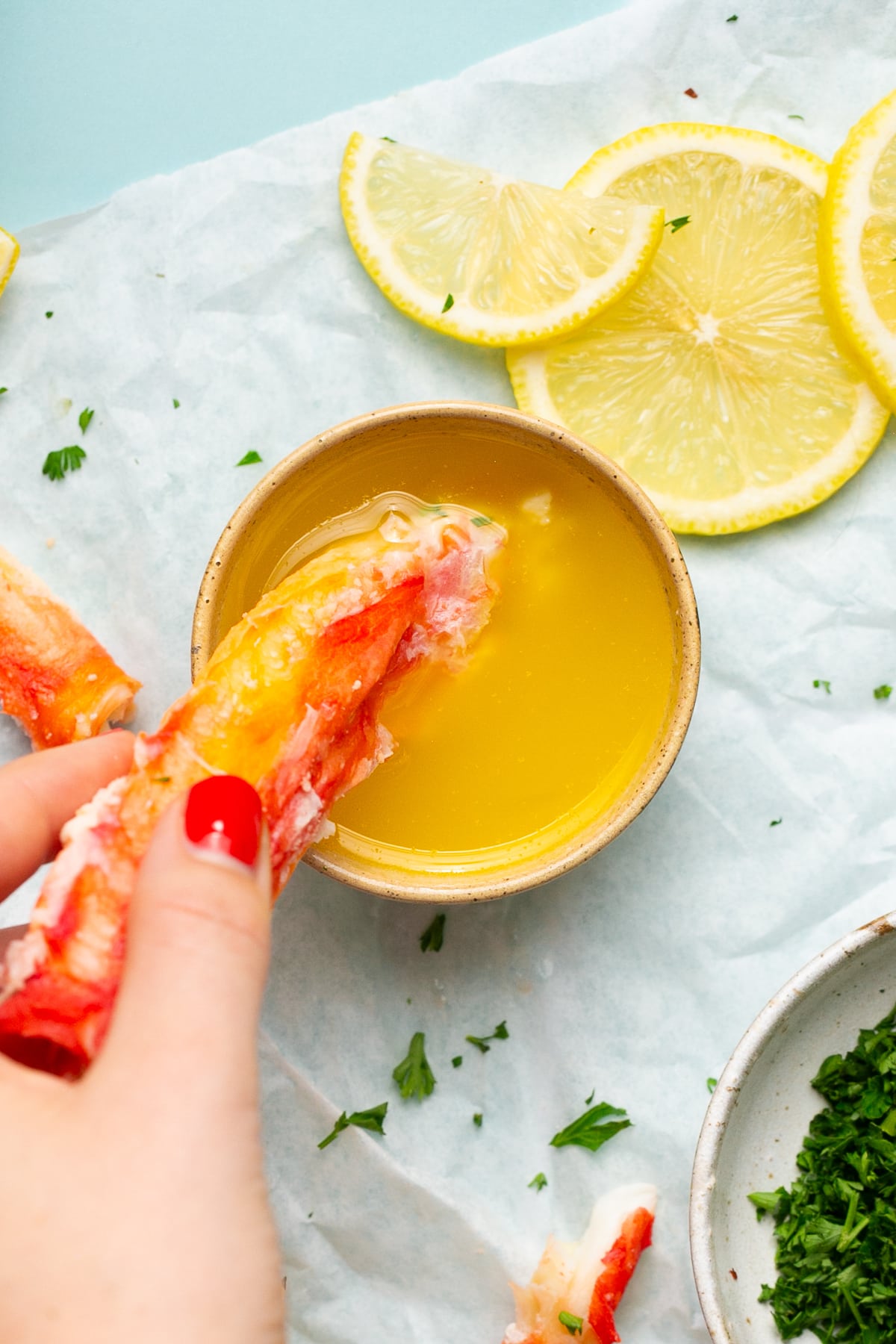 Crab Legs with melted butter and lemon wedges