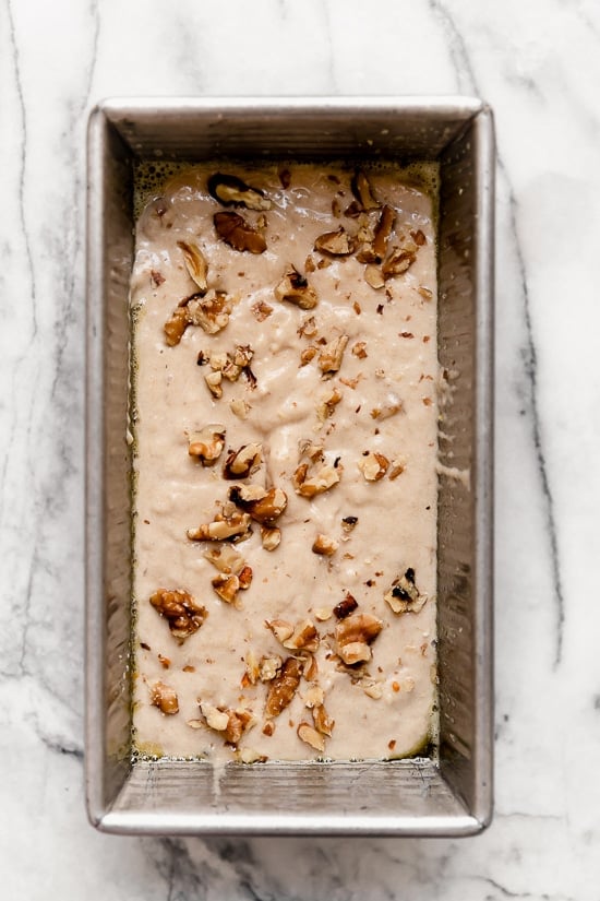 batter for banana bread with chopped walnuts