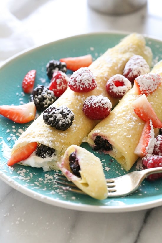 These blender crepes are so easy to make, and are perfect to serve for breakfast or dessert. They can be filled with fruit, jam, yogurt, ice cream, you name it!