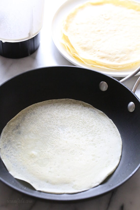 These blender crepes are so easy to make, and are perfect to serve for breakfast or dessert. They can be filled with fruit, jam, yogurt, ice cream, you name it!