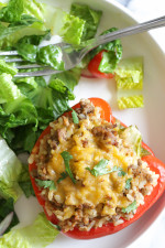 Delicious peppers stuffed with ground turkey and brown rice, seasoned with cumin, cilantro and spices then baked and topped with cheese are one of my favorites!