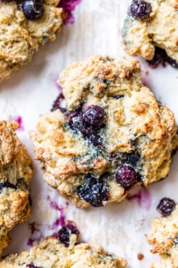 Lightened up, warm blueberry scones right out of the oven make the perfect Sunday morning breakfast along with a hot cup of tea.