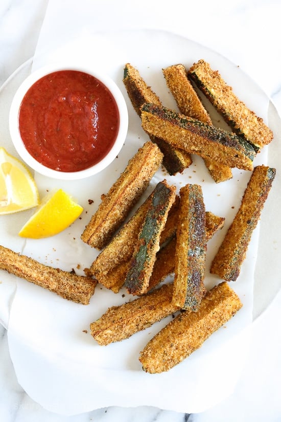 The kids love these healthy Baked Zucchini Sticks! Perfect served with marinara for dipping.