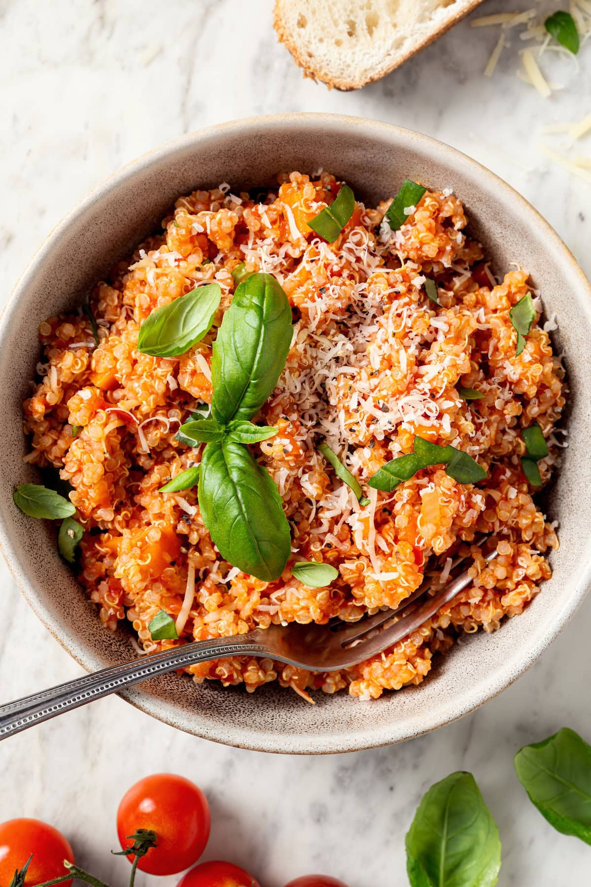 Bowl of quinoa risotto with fork.