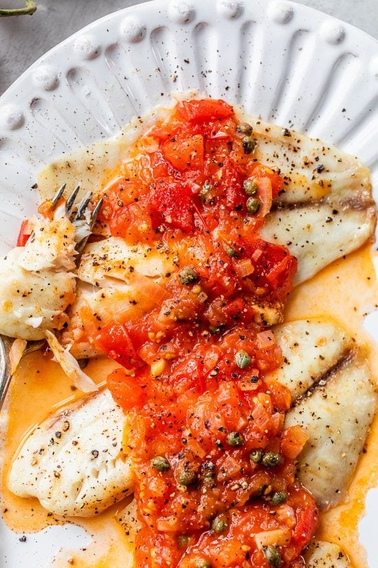 Grilled fish and tomato caper sauce