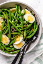 One of my favorite ways to enjoy green beans–in a chilled green bean salad recipe! The delicious flavors of these balsamic green beans made with black olives, scallions and eggs complement any meal or holiday potluck.