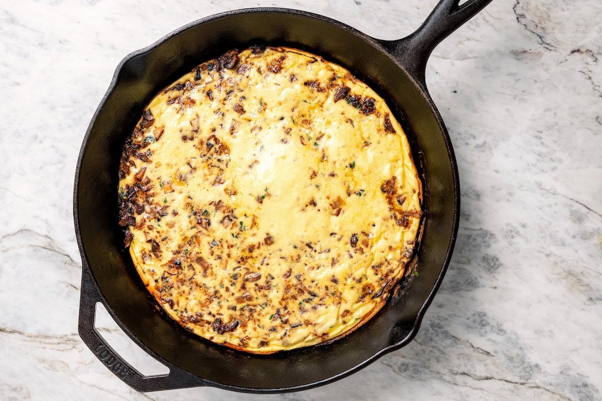 Baked mushroom frittata in a skillet.