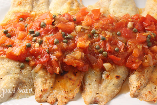 Broiled tilapia topped with tomato caper sauce