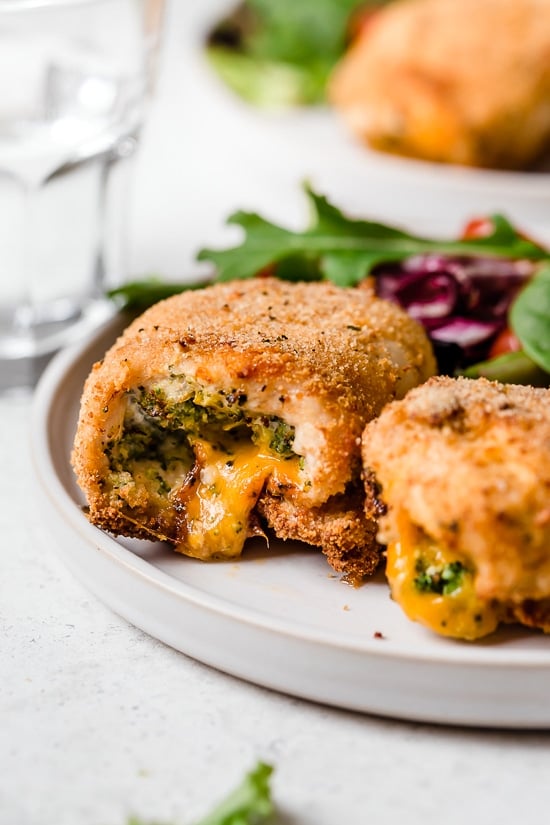 Broccoli and Cheese Stuffed Chicken is filled with cheddar and broccoli, then rolled up, breaded and baked in the oven or air fryer!