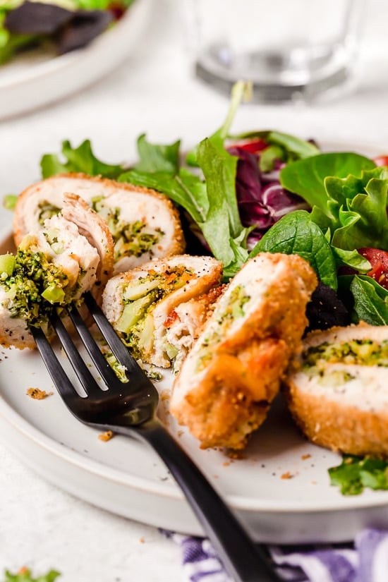 Broccoli and Cheese Stuffed Chicken are filled with cheddar and broccoli, then rolled up, breaded and baked in the oven or air fryer!