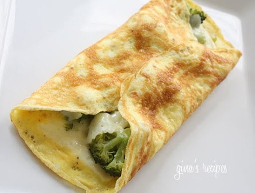 An omelet filled with broccoli and melted cheese