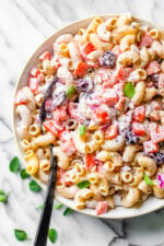 This lighter version of Macaroni Salad with tomatoes and black olives is the perfect side dish for any summer BBQ.