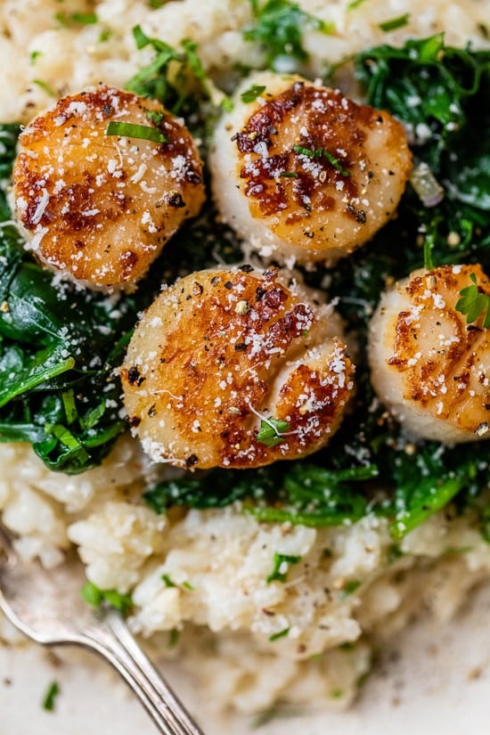Scallops Over Wilted Spinach Parmesan Risotto