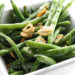 I was never a fan of string beans until I learned how to cook them properly. Now I love them. The trick is not to overcook them. This is a quick, healthy side dish for all you garlic lovers out there.