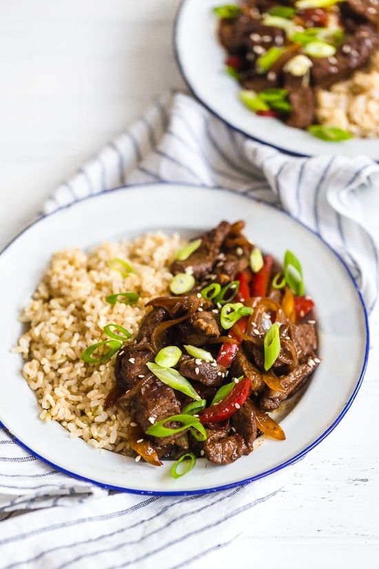 Pepper steak is quick, easy and perfect to whip up any night of the week. Strips of beef and bell peppers are stir fried in a wok to create a delicious main dish, ready in no time! I love it with brown rice, but cauliflower rice would also be great on the side.