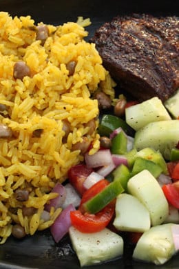 I've gotten requests to add more latin recipes to my site which for me is never a problem since I LOVE latin food! Arroz Con Gandules (Rice with Pigeon Peas) is a Puerto Rican dish popular in the Carribean. The pigeon peas are loaded with fiber which makes this a healthy side if cooked right.