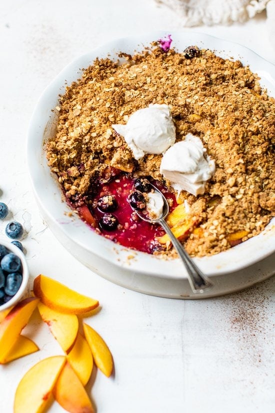 Blueberry Peach Crisp with a spoon
