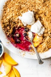 Blueberry Peach Crisp with a spoon