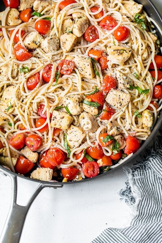 Spaghetti with Sauteed Chicken and Grape Tomatoes in a skillet