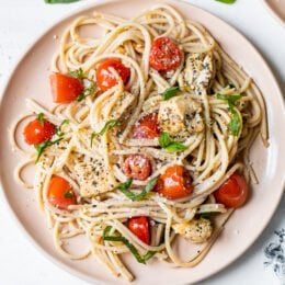 Spaghetti with Sauteed Chicken and Grape Tomatoes on a plate.