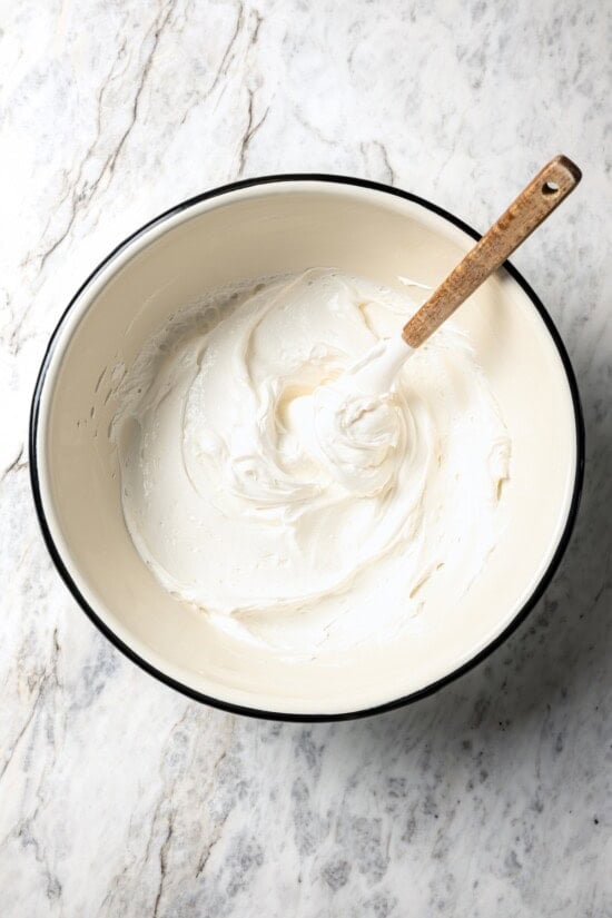 Filling for banana cream pie in mixing bowl.