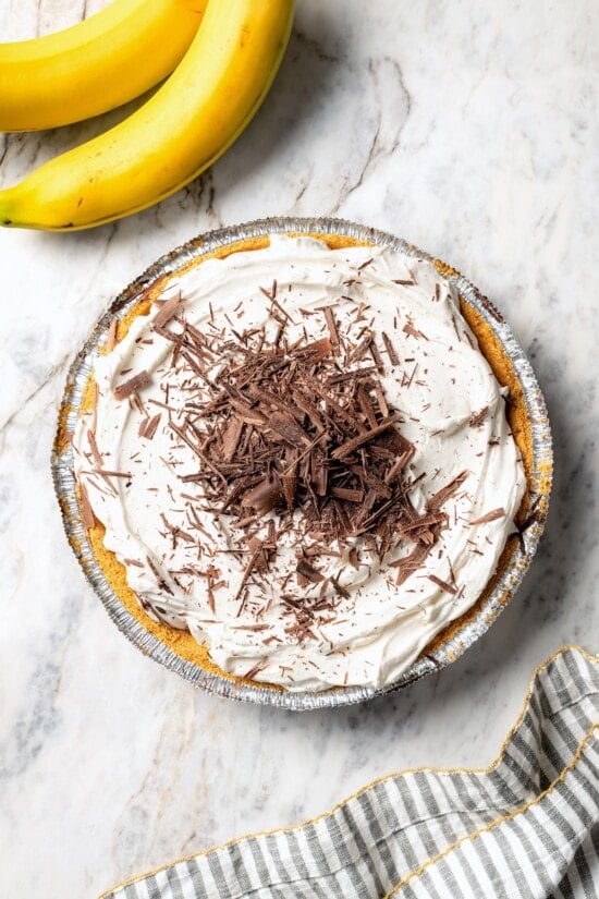 Chocolate shavings added to banana cream pie.