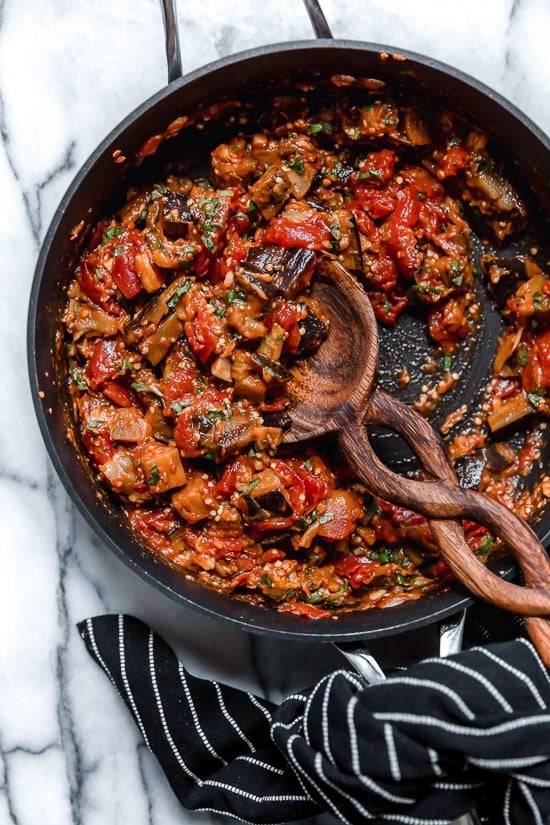 This simple Eggplant and Tomato Sauce is delicious, made with diced eggplant stewed in tomatoes and garlic. I love it served over pasta but it's also great as a side dish on it's own.