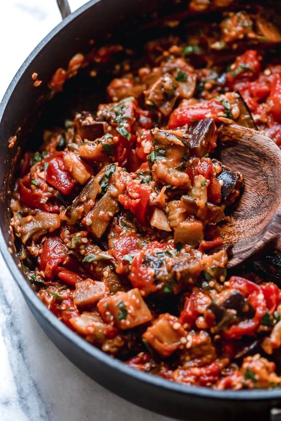 This simple Eggplant and Tomato Sauce is delicious, made with diced eggplant stewed in tomatoes and garlic. I love it served over pasta but it's also great as a side dish on it's own.