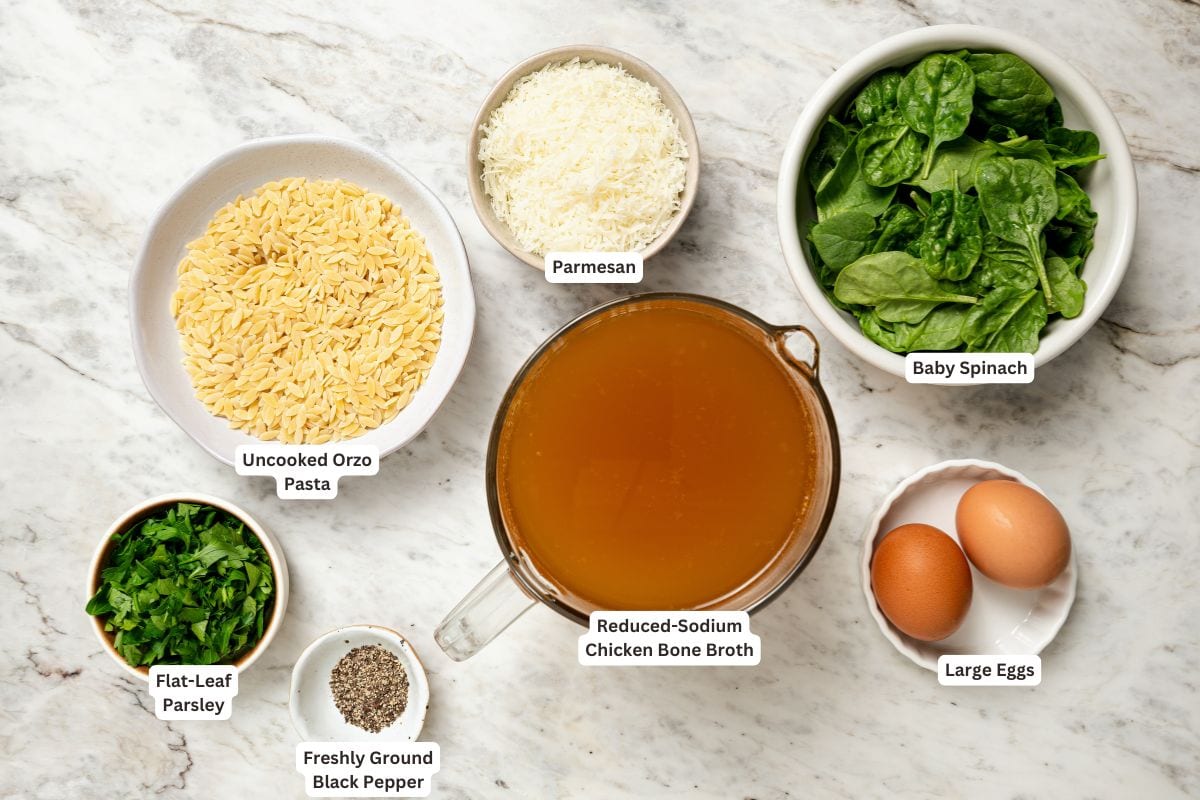 Ingredients for stracciatella soup with orzo and spinach.