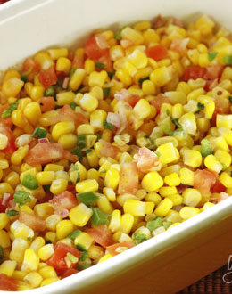 This easy corn salsa made with lime, cilantro and tomatoes are perfect with chips or served over your favorite tacos or burrito bowls!