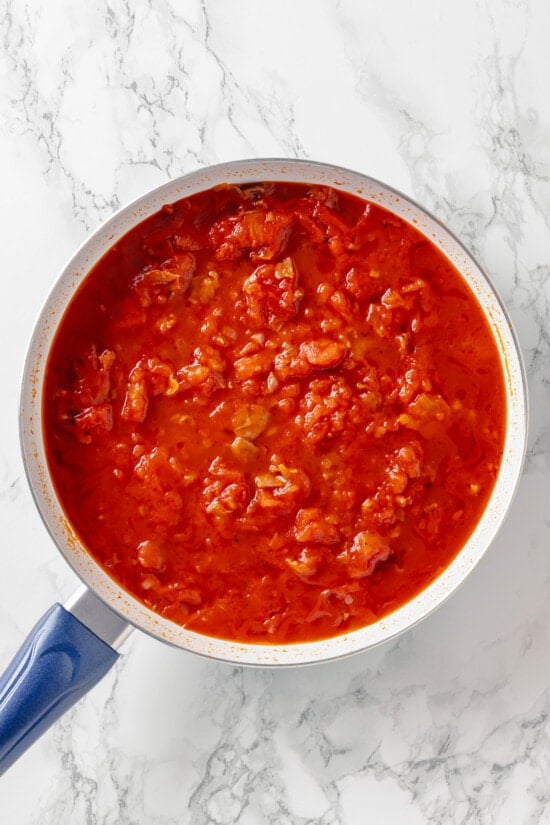 Crushed and canned tomatoes in a pan
