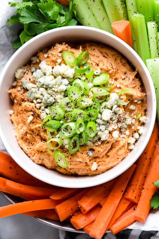 This Slow Cooker Buffalo Chicken Dip has everything you love about buffalo wings, only made into a dip – no messy hands!