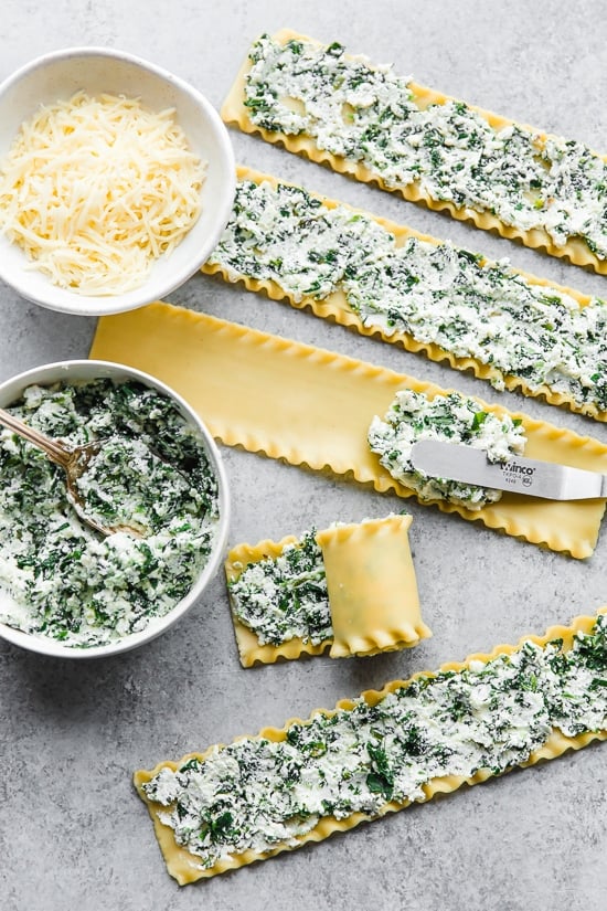 These EASY Spinach Lasagna Roll ups are totally delicious, perfect for entertaining or serving for weeknight meals. Individual vegetarian lasagnas filled with spinach and cheese are family-friendly, satisfying and perfect for portion control. It's also a great way to get your kids to eat spinach and no one will miss the meat!
