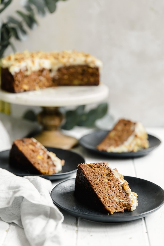 This super moist carrot cake recipe made from scratch is perfect for Easter or anytime of the year. Made with a can of crushed pineapple which makes it very moist, without adding a ton of fat.