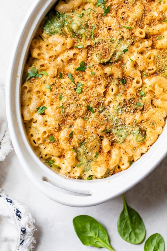This creamy baked mac and cheese recipe is a lighter version of the classic recipe with added fiber from spinach. It