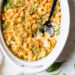 This creamy baked macaroni and cheese recipe is a lighter version of the classic recipe with added fiber from spinach. It's comfort food at it's finest!