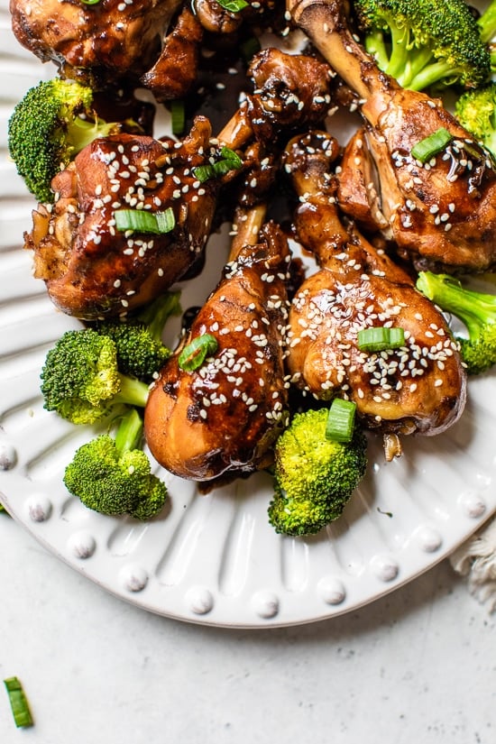 Asian chicken on a plate with broccoli.
