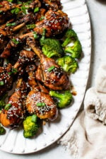 Soy sauce, vinegar and Sriracha hot sauce make these Asian-Glazed Chicken Drumsticks savory delicious – serve over rice or vegetables for an easy meal!
