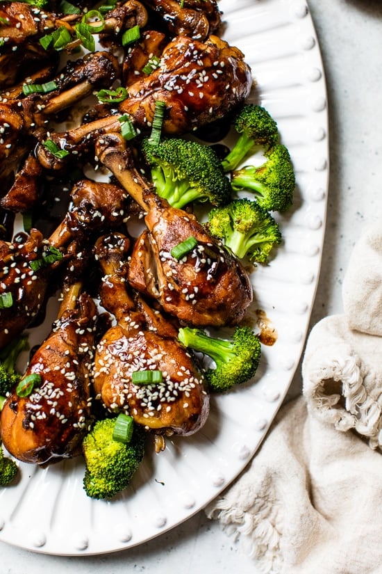 Soy sauce, vinegar and Sriracha hot sauce make these Asian-Glazed Chicken Drumsticks savory and delicious – serve over rice or vegetables for an easy meal!