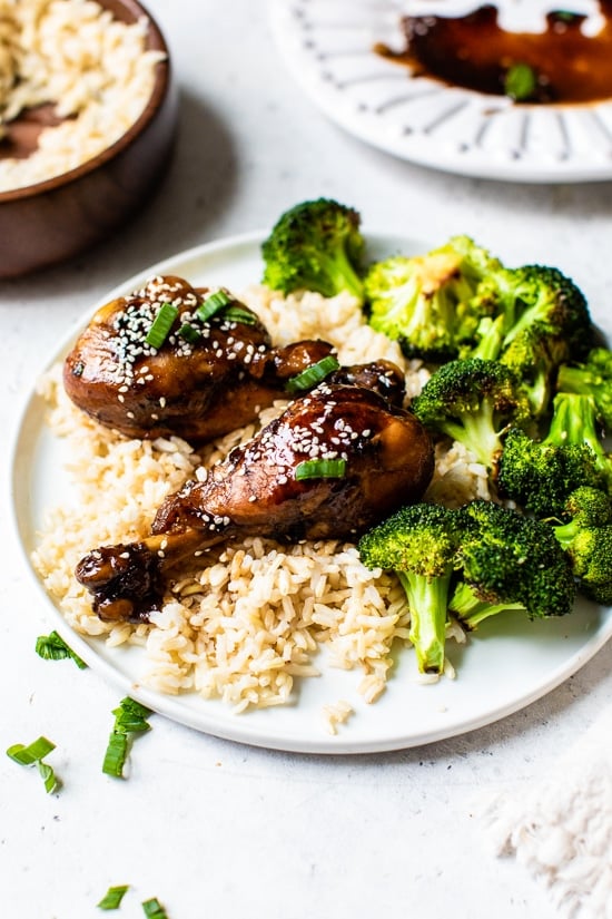 Soy sauce, vinegar and Sriracha hot sauce make these Asian-Glazed Chicken Drumsticks savory delicious – serve over rice or vegetables for an easy meal!