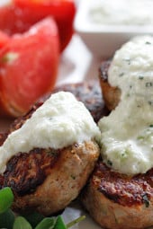 Greek Turkey Meatballs slathered with Tzatziki sauce, great over rice, with chickpea salad or served as an appetizers. Also great for make-ahead meal prep lunch.