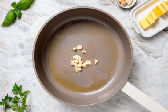 Garlic in pan of oil.